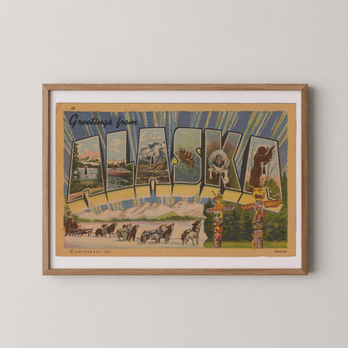 Vintage "Greetings from Alaska" large letter postcard print, with oversized vintage-style block letters spelling ALASKA filled with nostalgic scenic snapshots, celebrating Alaska as a U.S. state travel keepsake. Printed as a giclée fine art print on archival matte paper.
