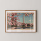 Vintage horizontal landscape postcard print of the Washington Monument framed by flowering pink cherry blossom branches in Washington, D.C. Printed as a giclée fine art print on archival matte paper.