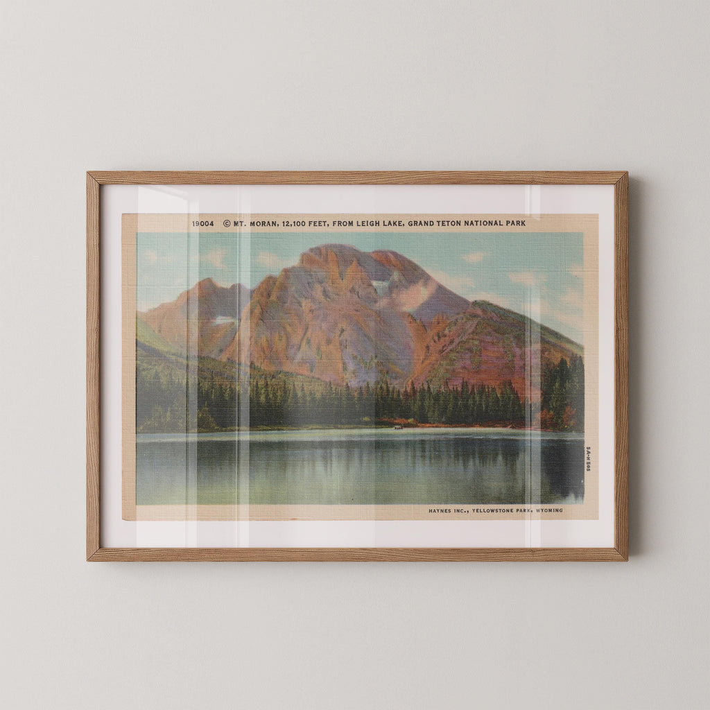 Vintage landscape postcard print of Mount Moran's rugged peak rising over the valley, Grand Teton National Park. Printed as a giclée fine art print on archival matte paper.