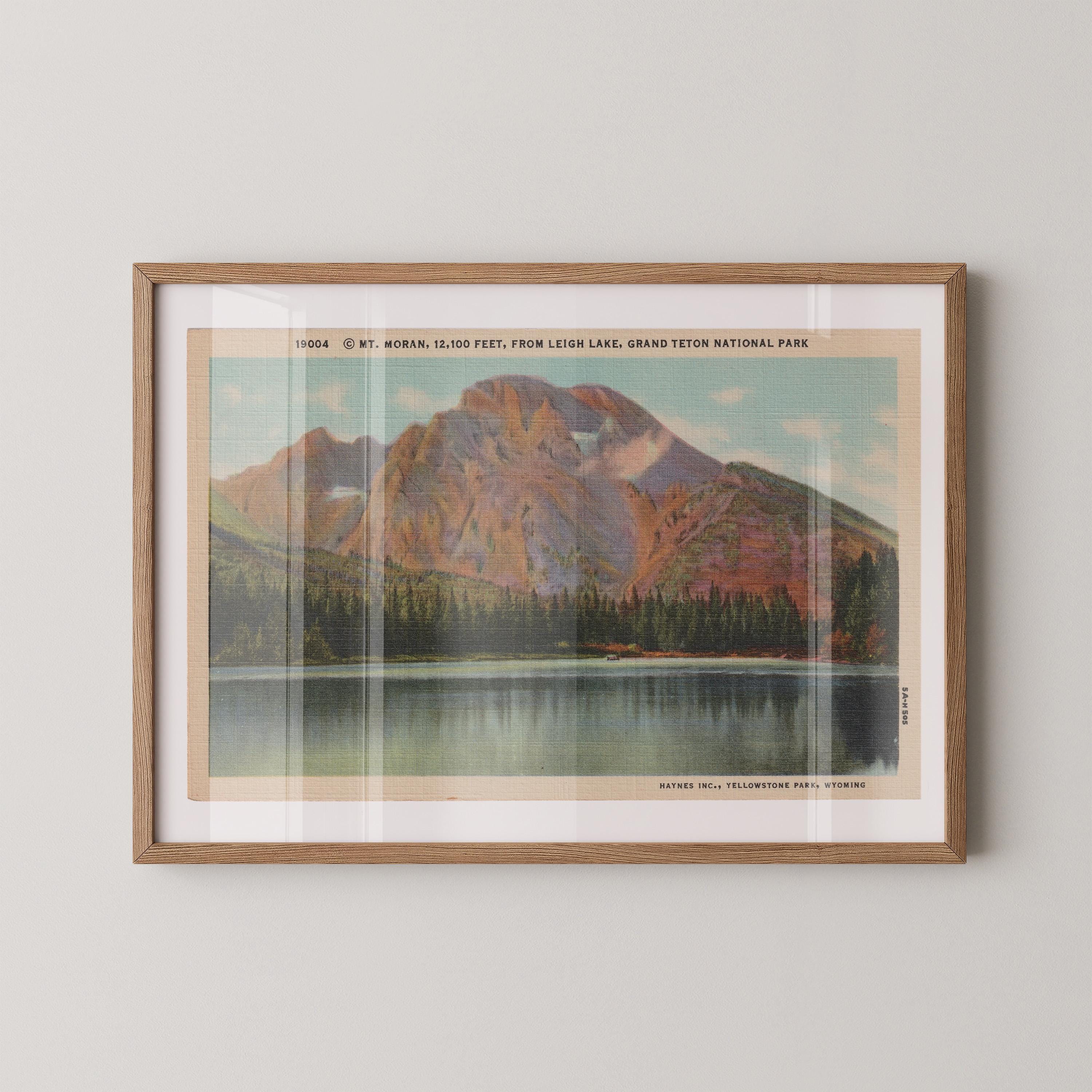 Vintage landscape postcard print of Mount Moran's rugged peak rising over the valley, Grand Teton National Park. Printed as a giclée fine art print on archival matte paper.